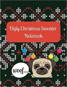 A gratitude journal with a dog wearing a sweater decorated with ornaments.