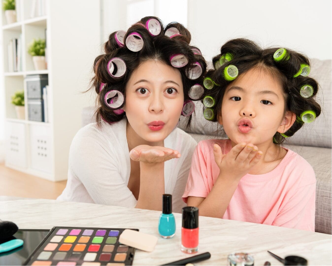 Two women and a girl blowing kisses in a children’s book author's fresh perspective.